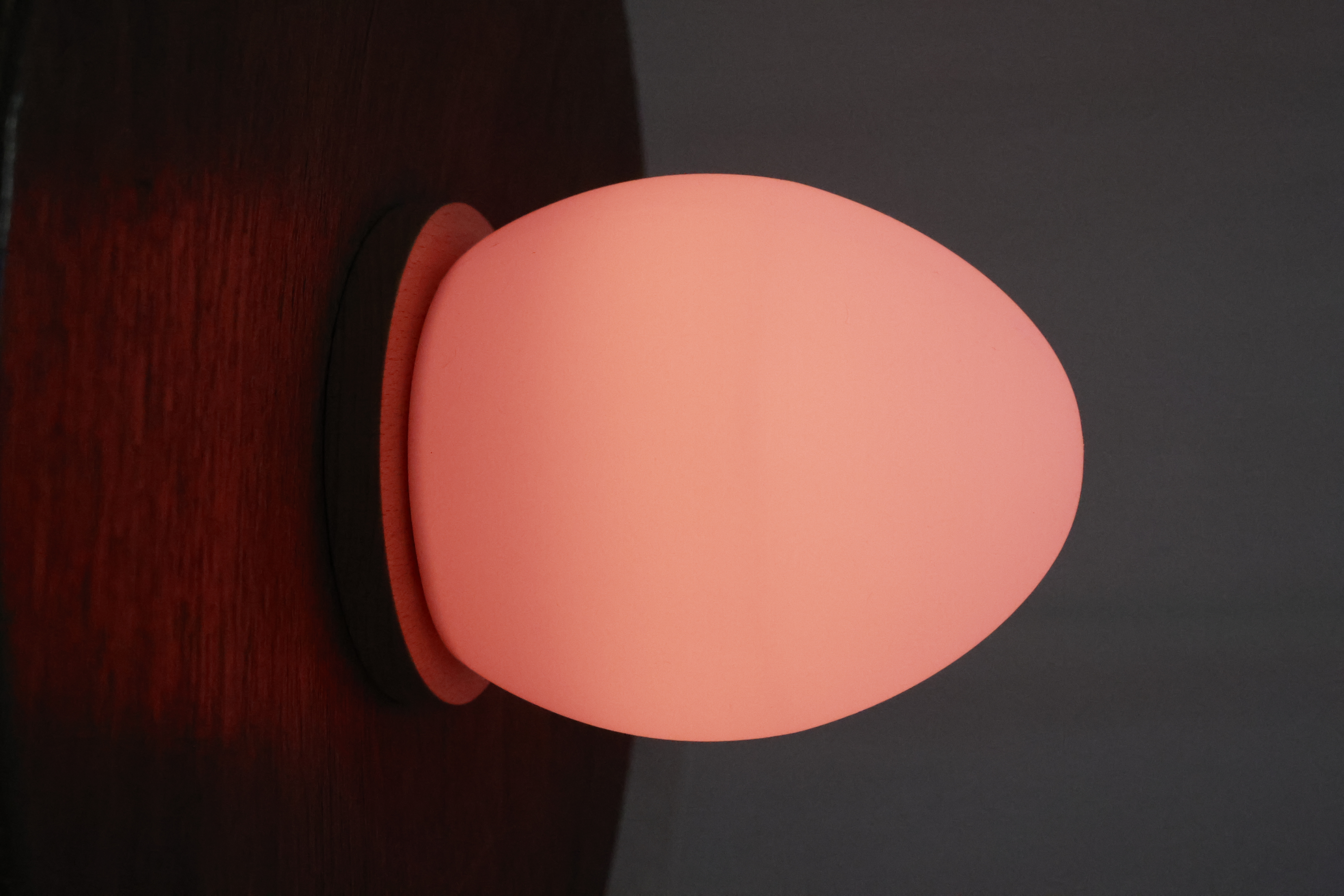 Close-up of Lume and its wooden base
