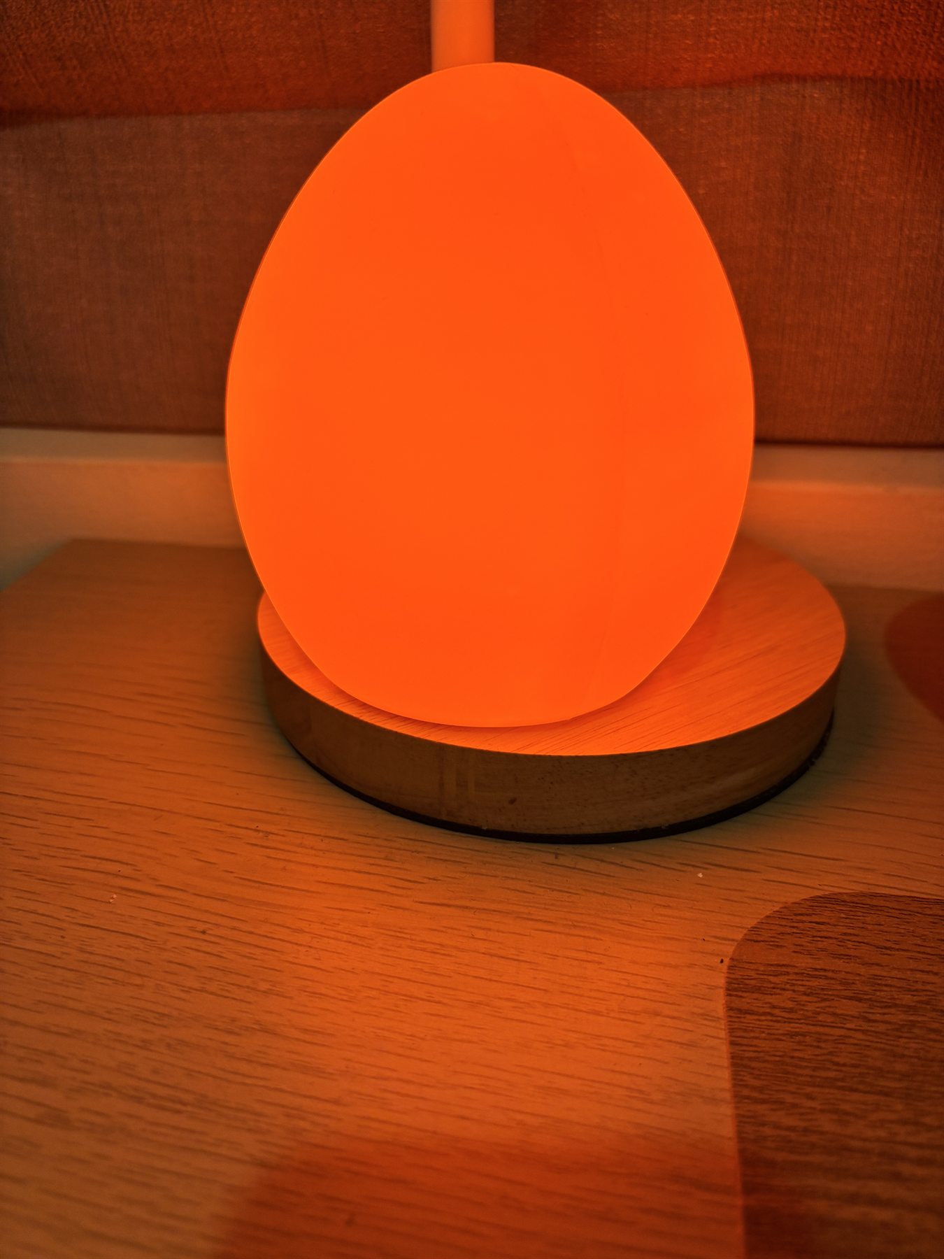 Owlnest Lume glowing with deep amber light